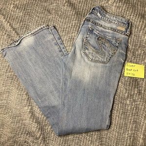 Silver light wash, boot cut jeans. Size 26/31
